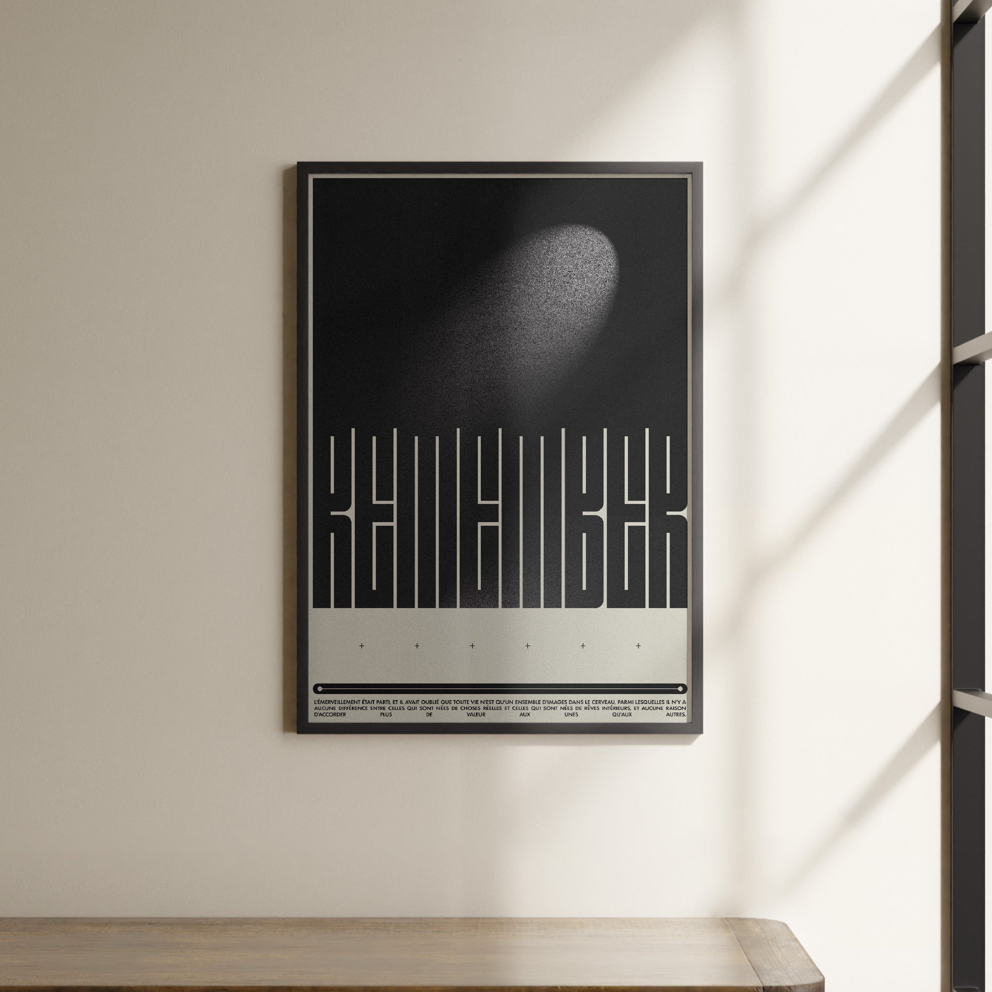 a black and white poster hanging on a wall