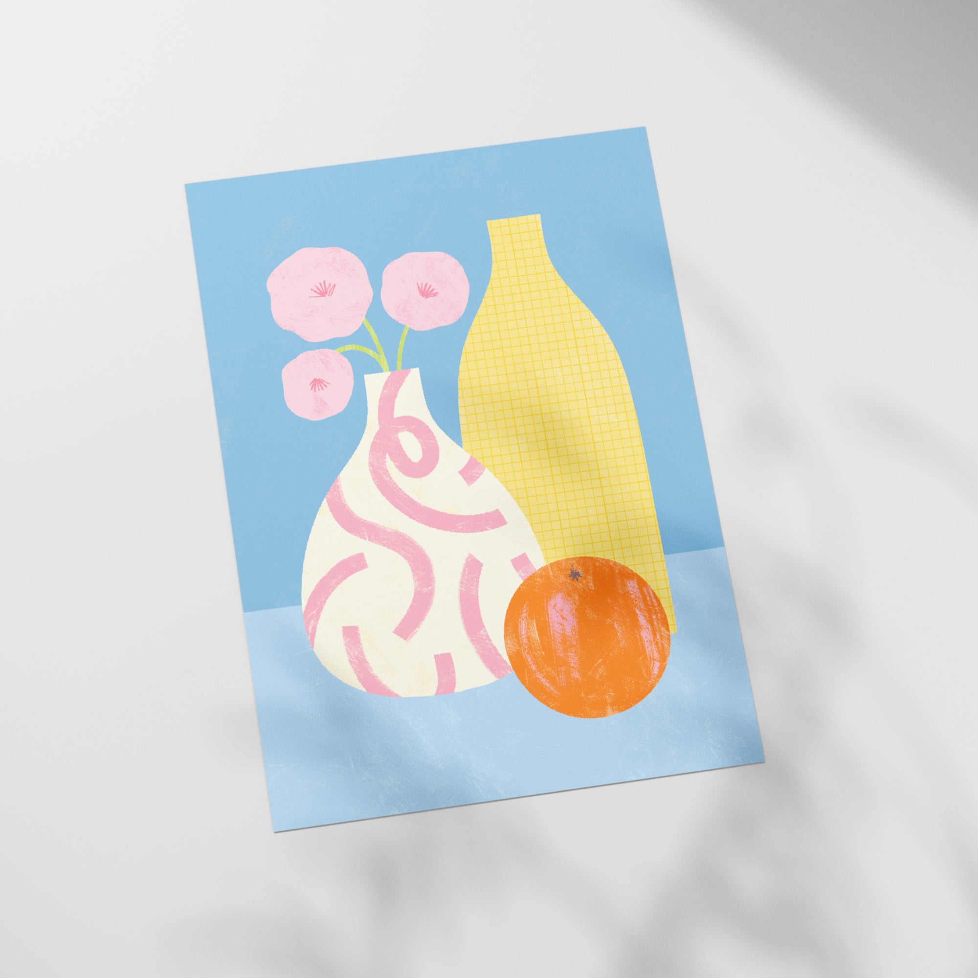 a picture of a vase with flowers and an orange