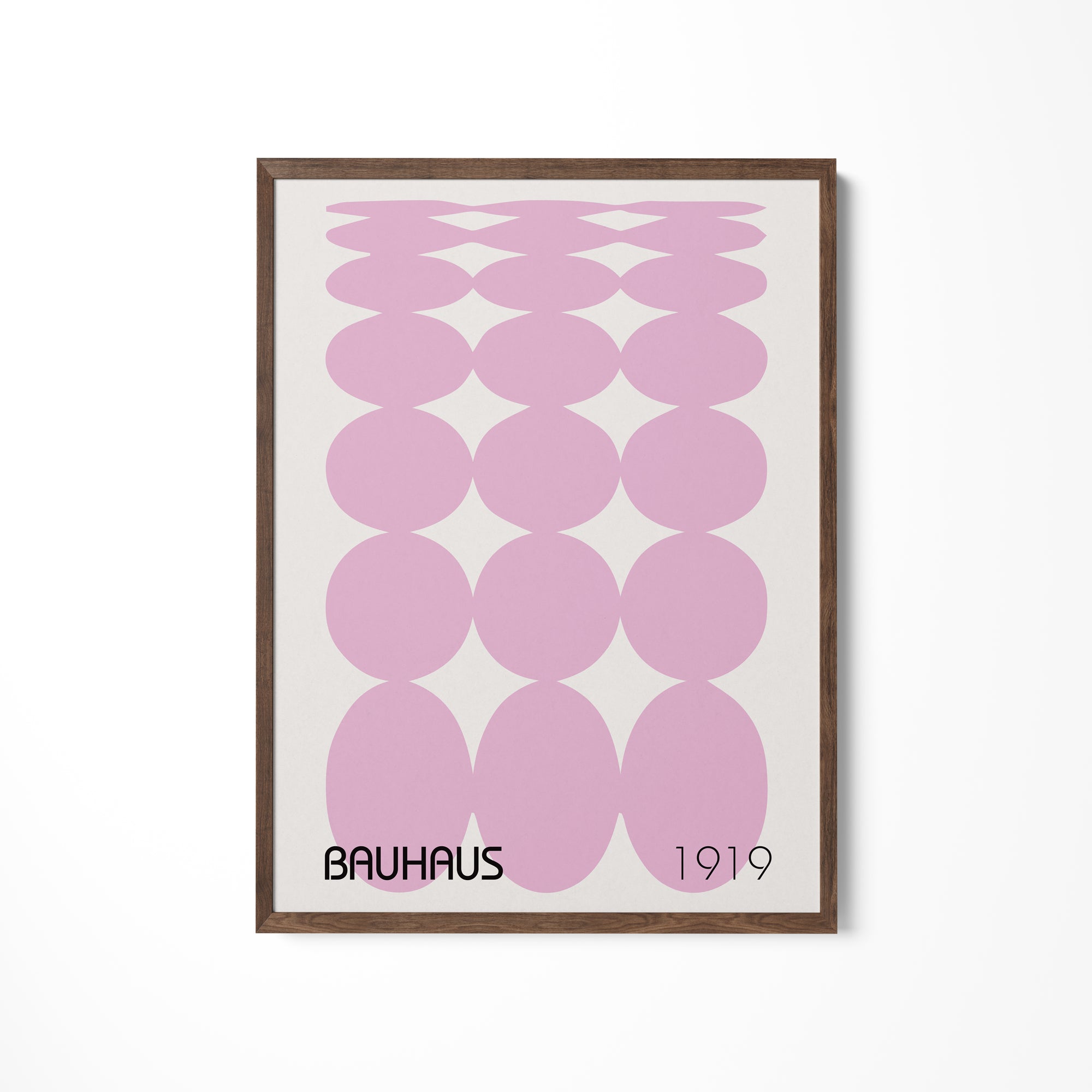 a pink and white poster hanging on a wall