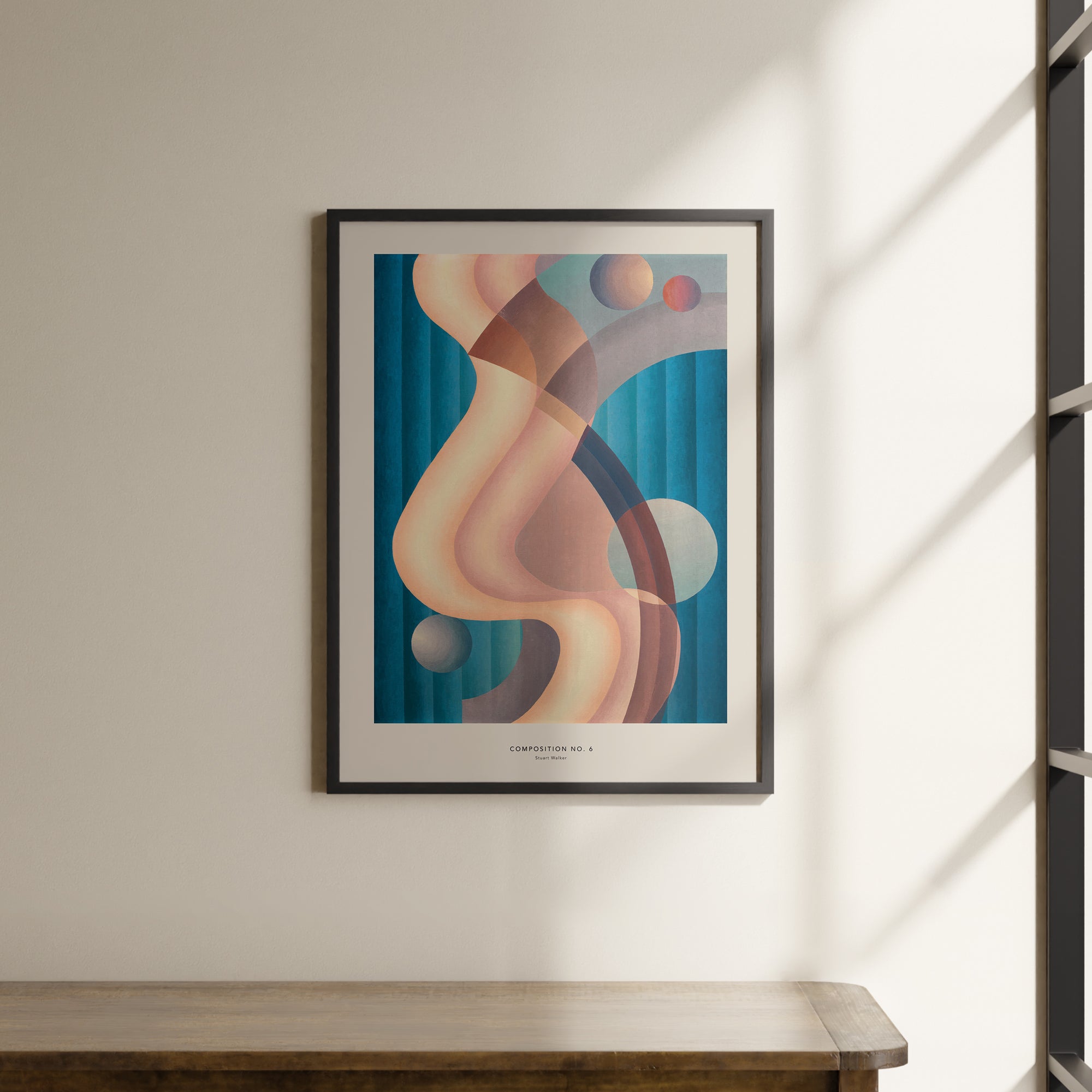 a painting hanging on a wall next to a wooden table