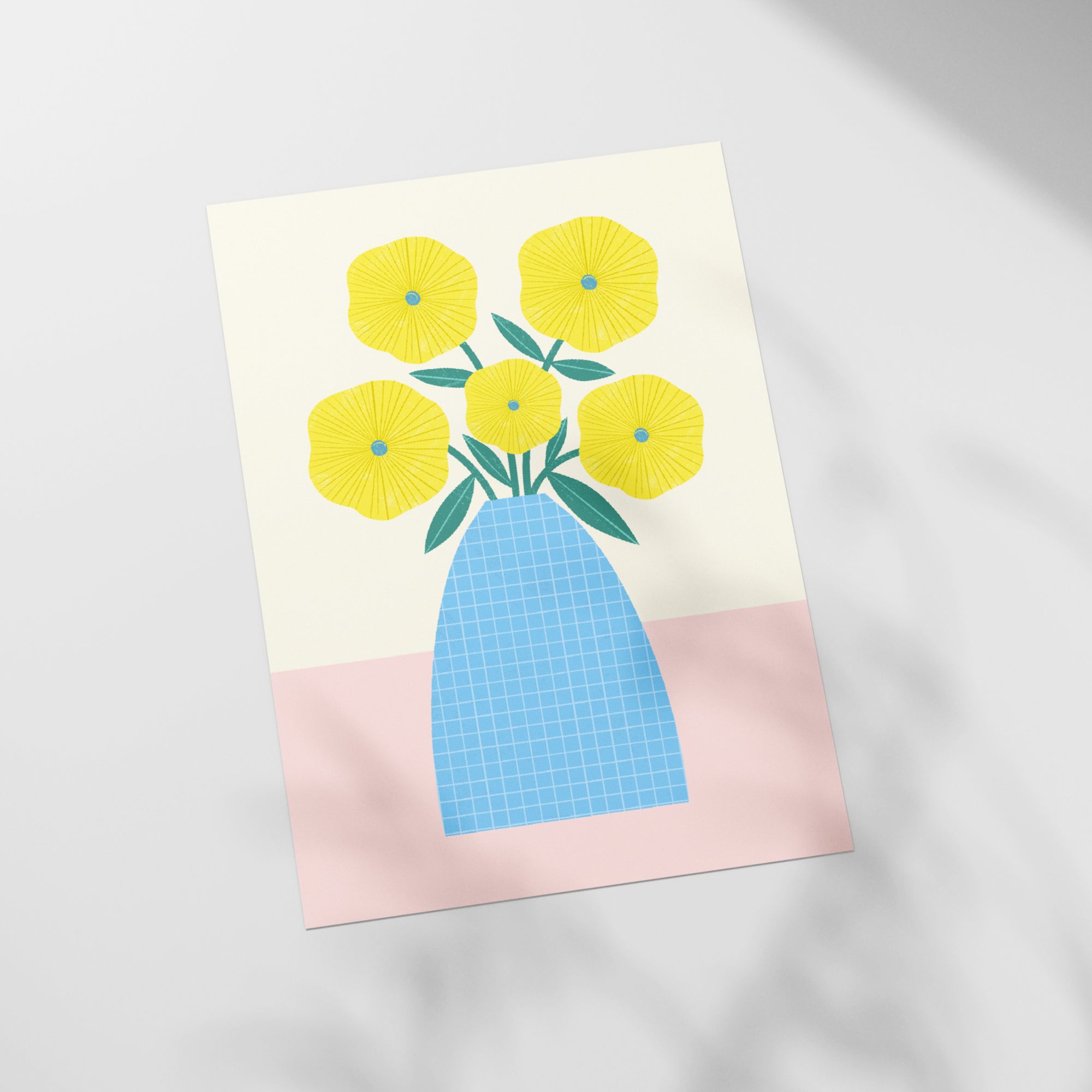 a picture of a blue vase with yellow flowers