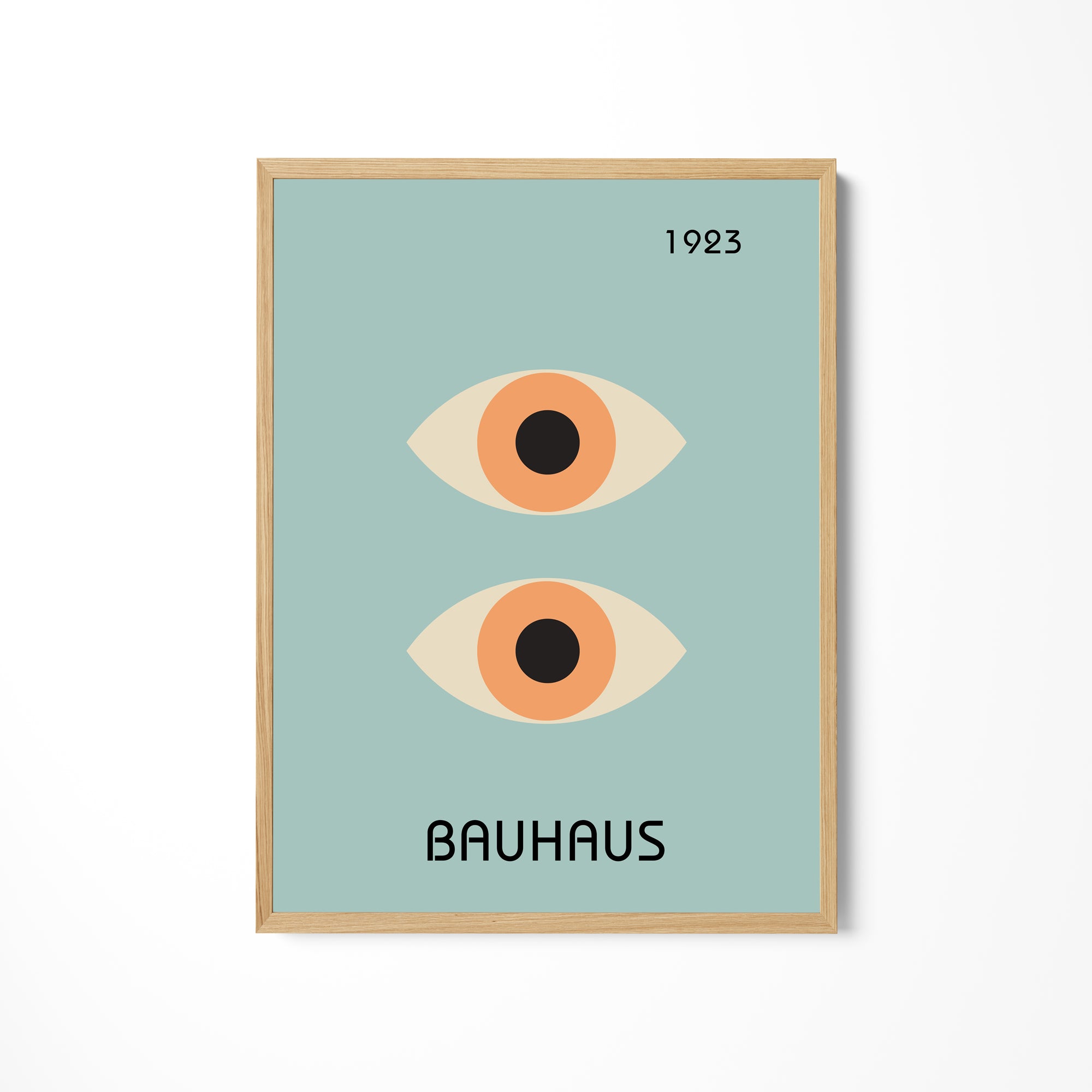 a poster of two orange eyes with the words bauhaus