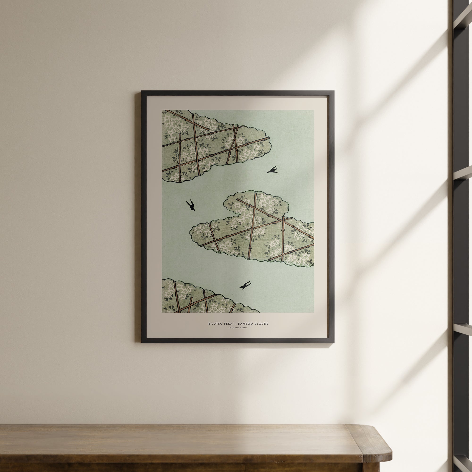 a picture hanging on a wall above a wooden table