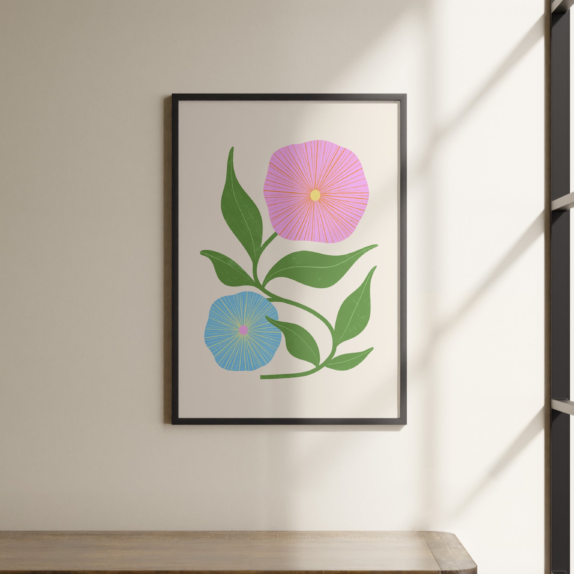 a picture of a pink flower on a white wall