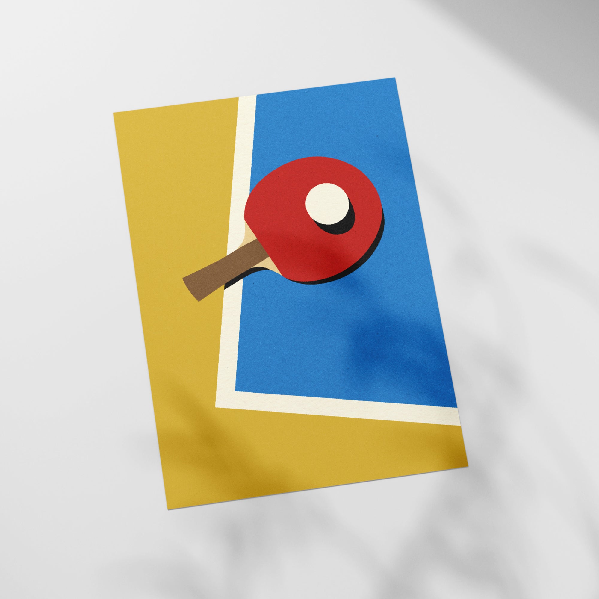 a ping pong paddle on top of a piece of paper