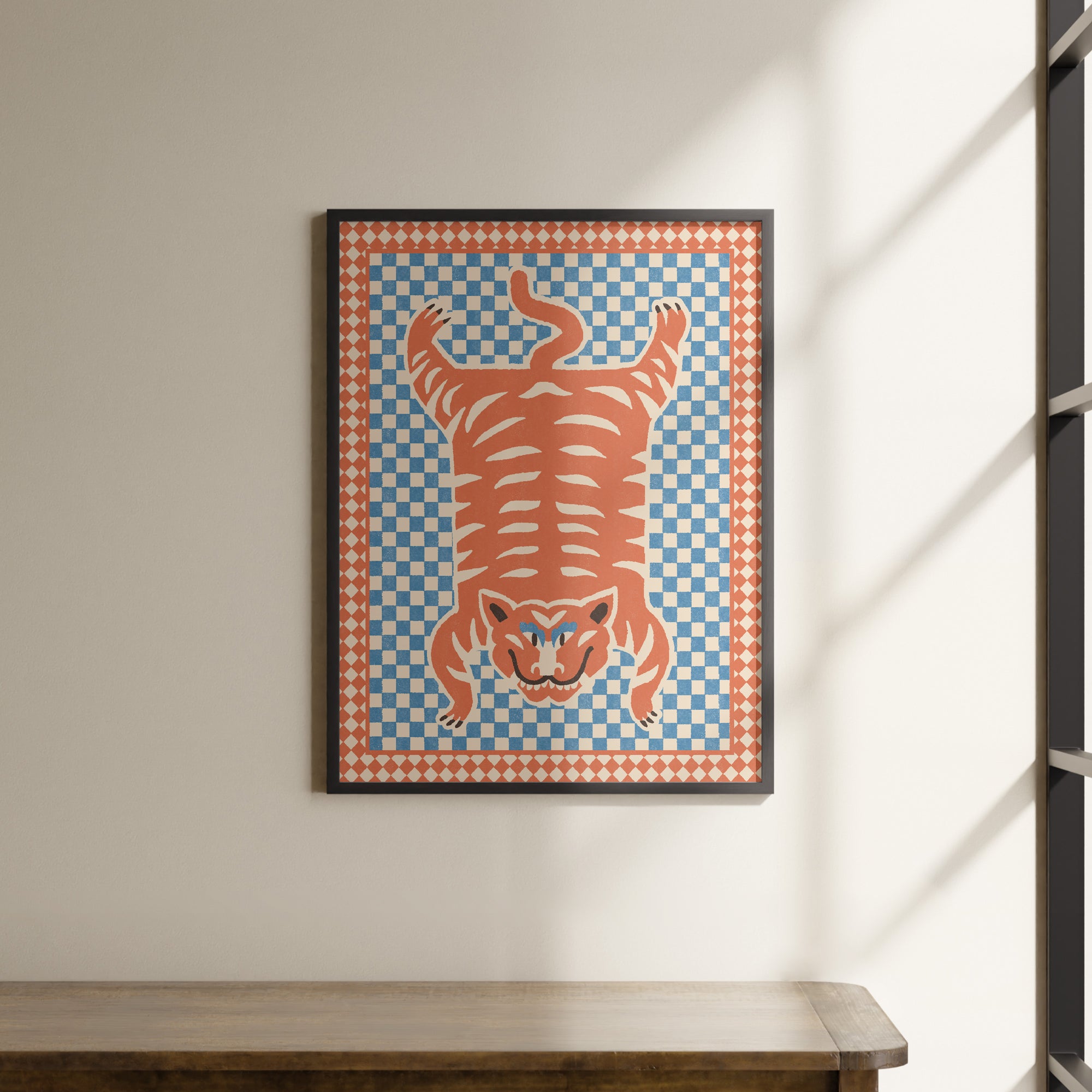 a painting hanging on a wall next to a wooden table