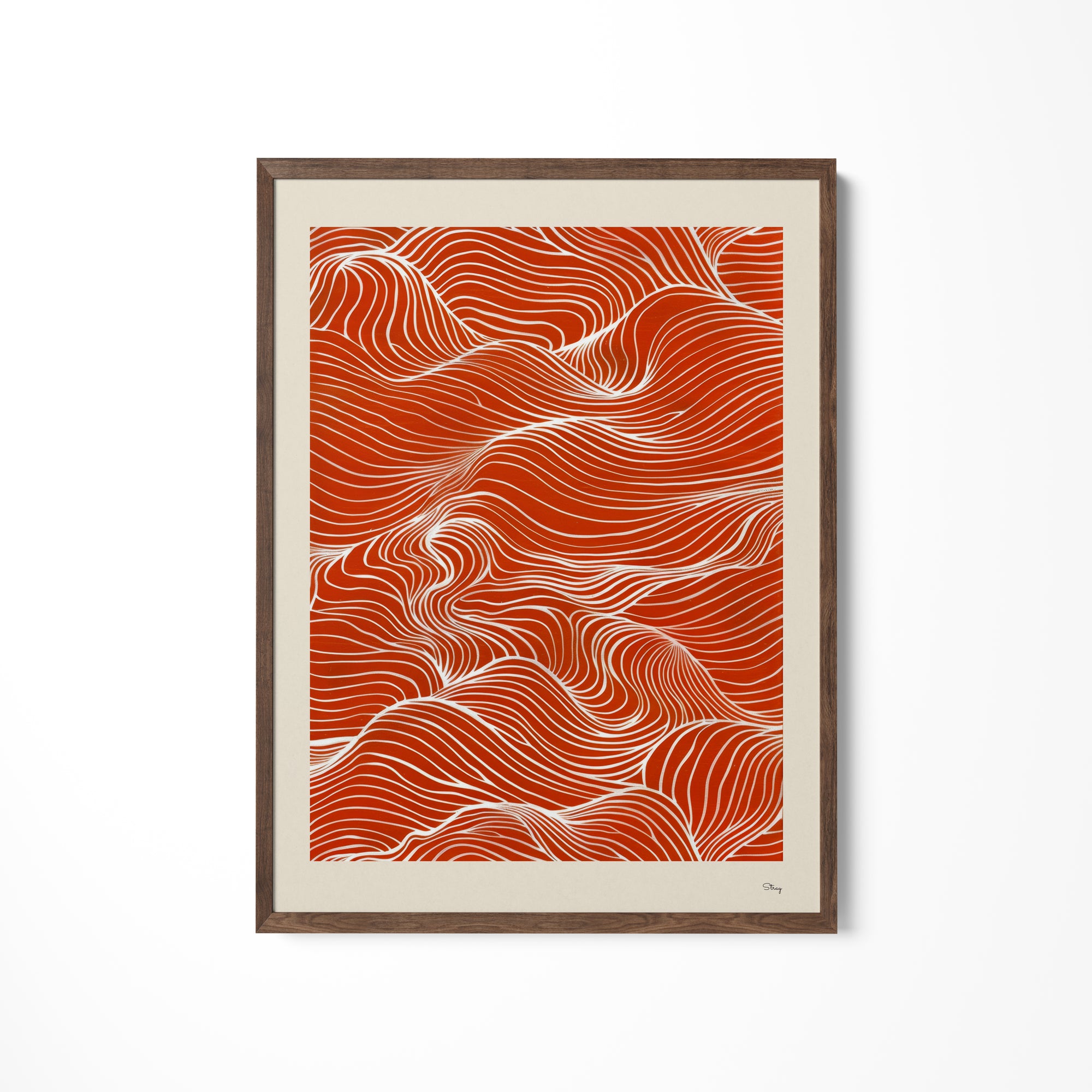 a red and white art piece hanging on a wall