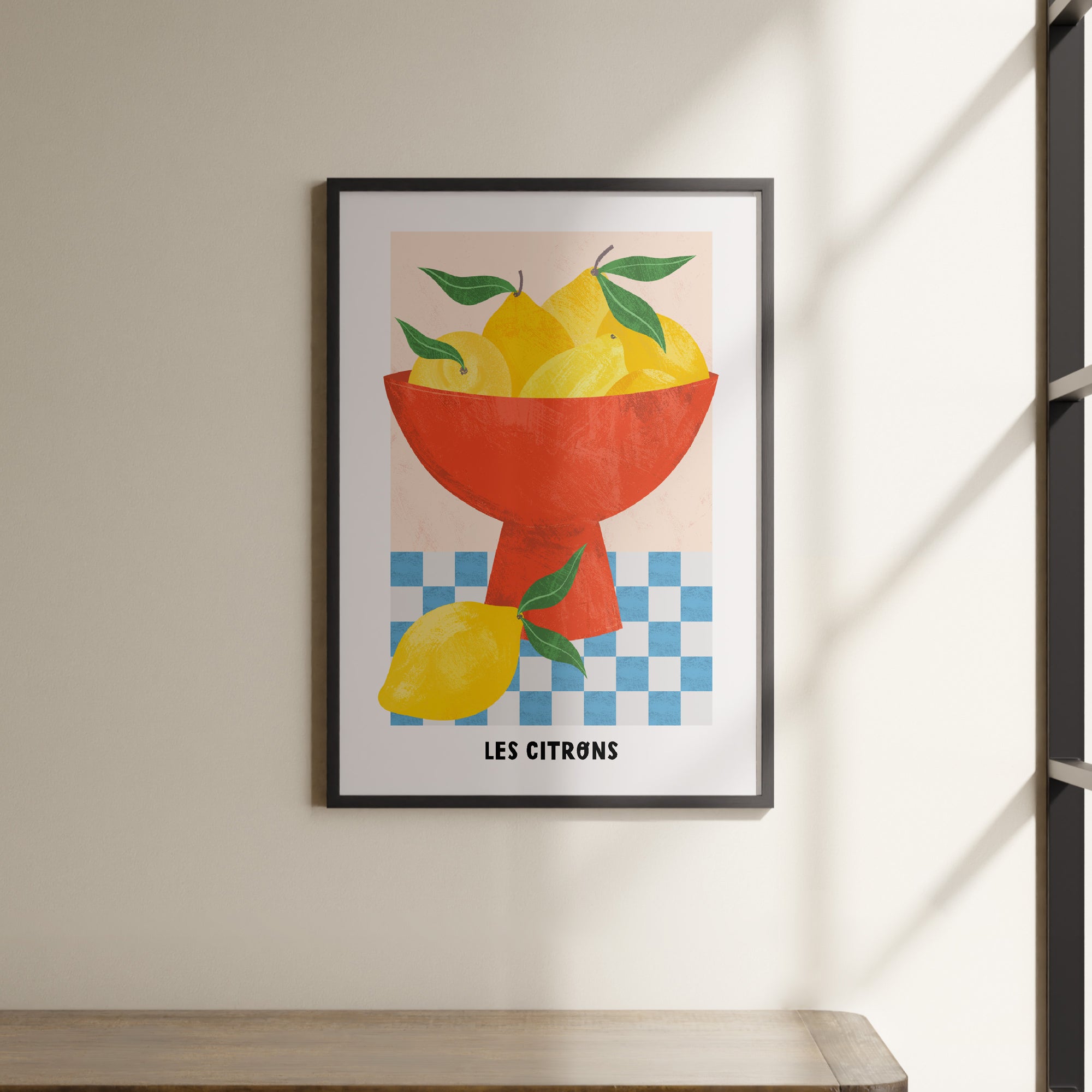 a picture of a bowl of lemons hanging on a wall