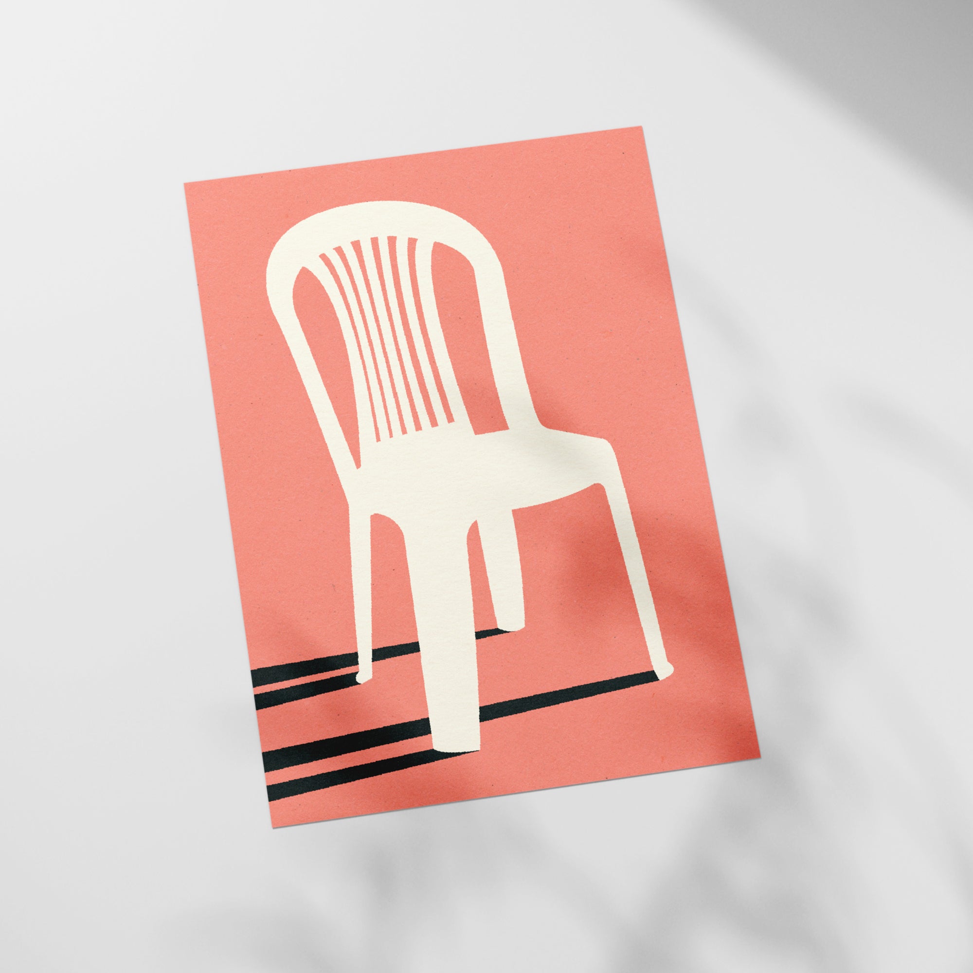 a paper cut out of a chair on top of a table