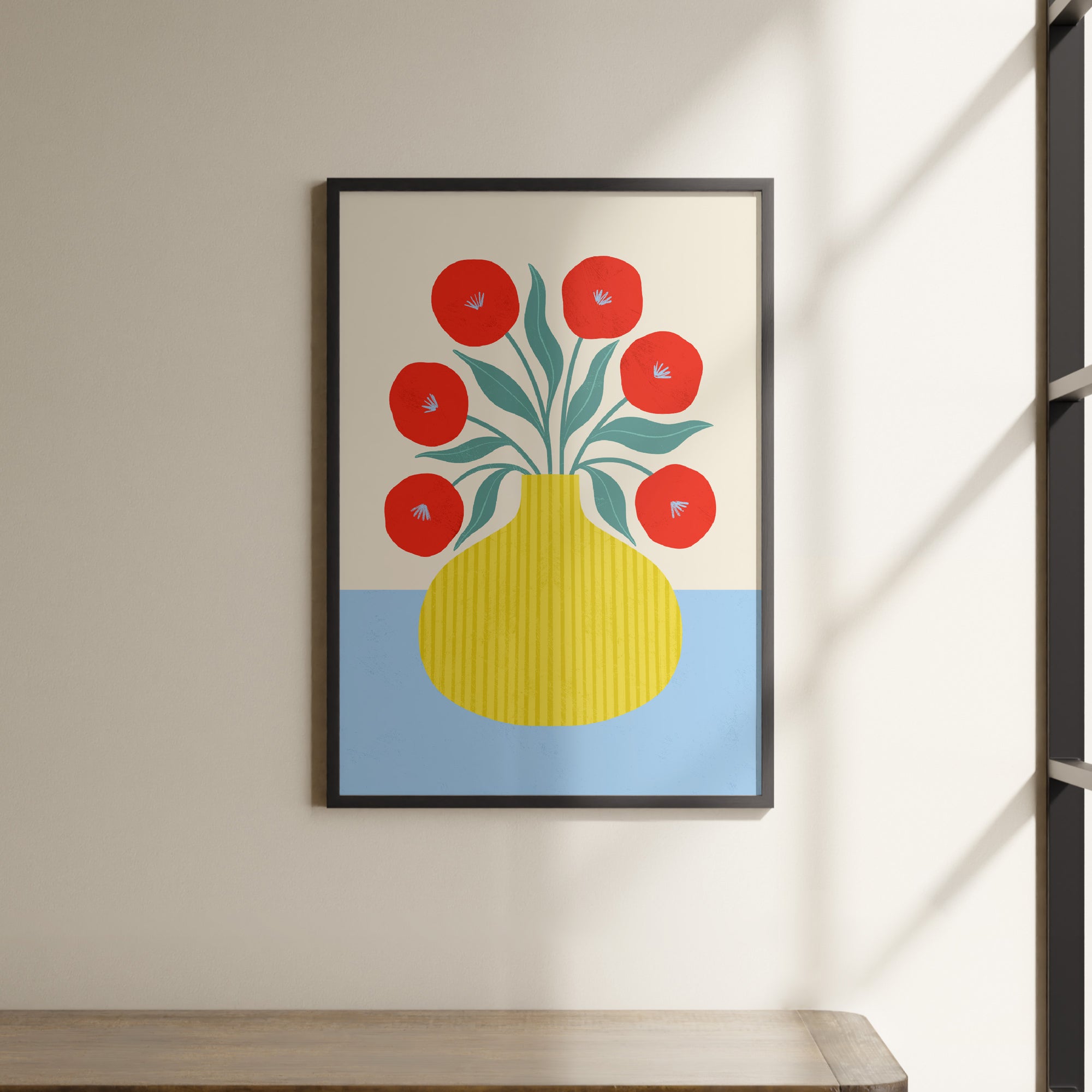 a picture of a yellow vase with red flowers