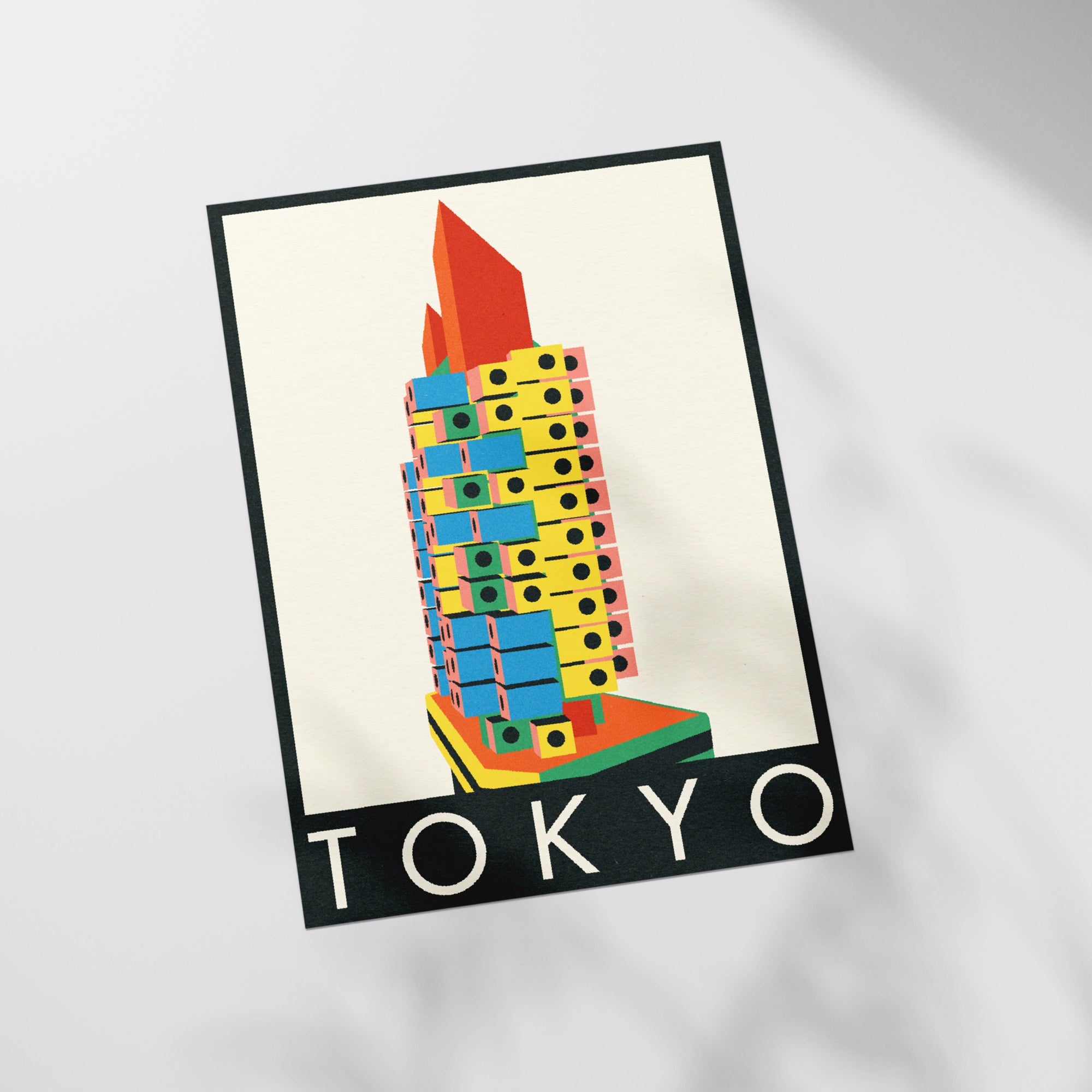 a picture of a tall building with the word tokyo on it