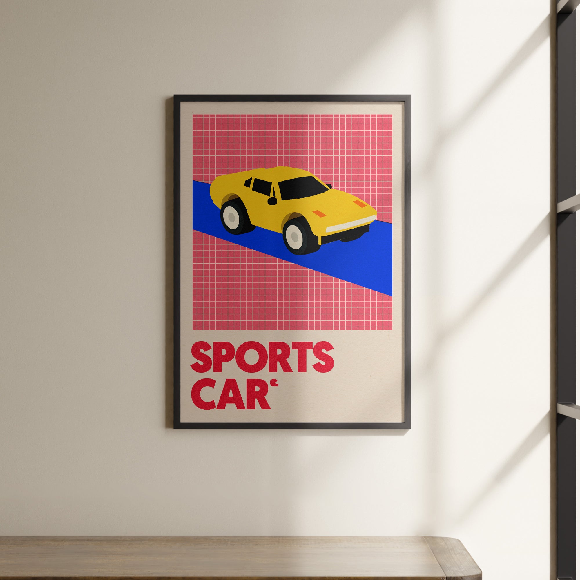 a picture of a sports car hanging on a wall