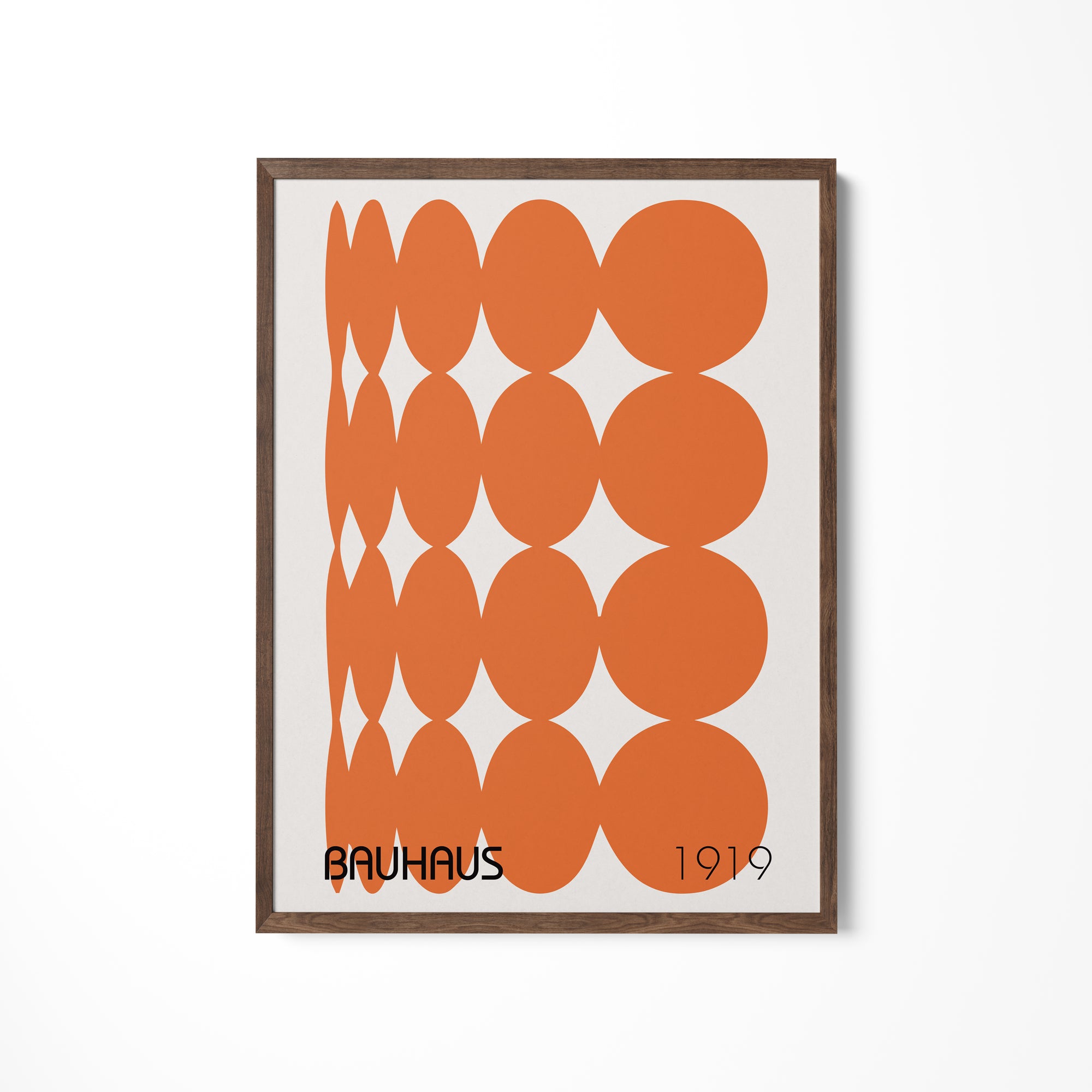 an orange and white poster hanging on a wall