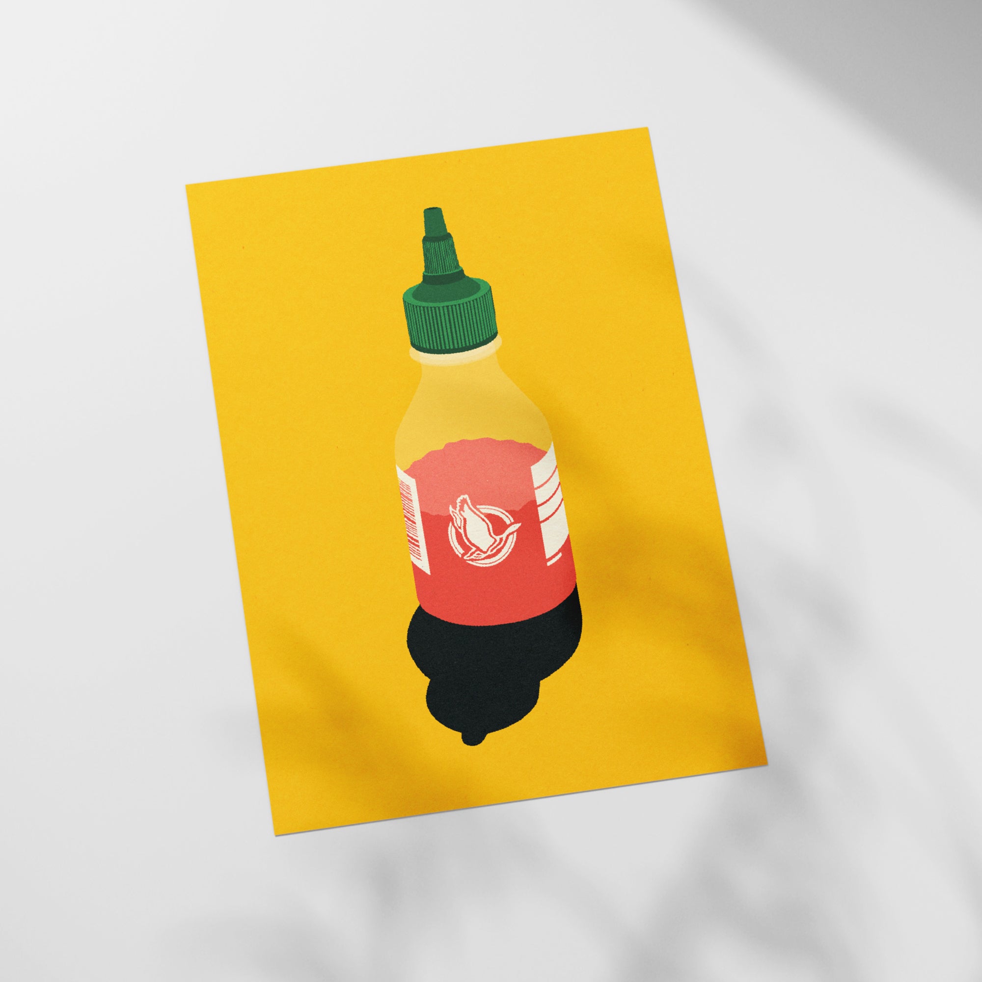 a bottle of ketchup sitting on top of a piece of paper