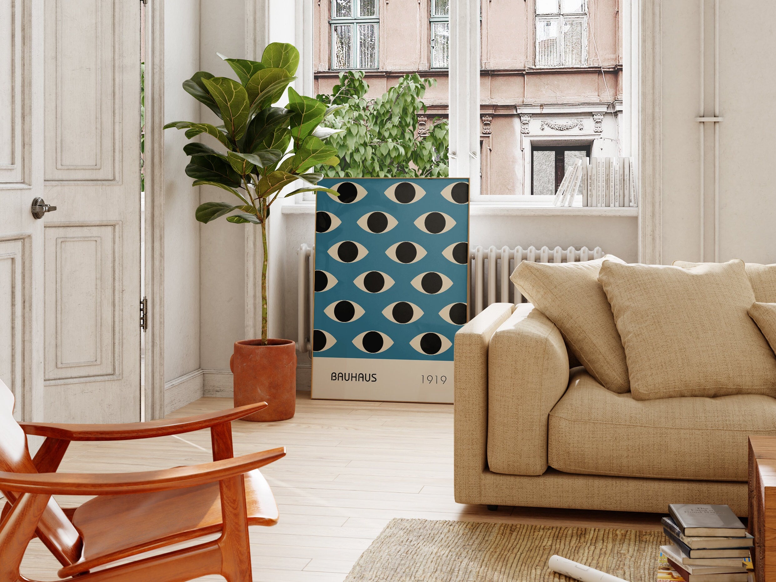 a living room filled with furniture and a potted plant