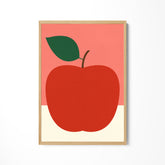 a picture of a red apple with a green leaf