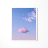 a pink cloud floating in a blue sky