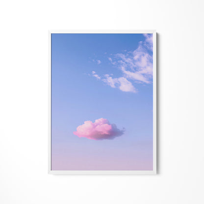 a pink cloud floating in a blue sky