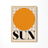 a picture of a sun on a white wall