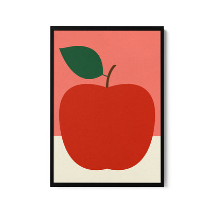 a red apple with a green leaf on a pink background