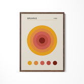 a picture of a brown and orange circle on a white wall
