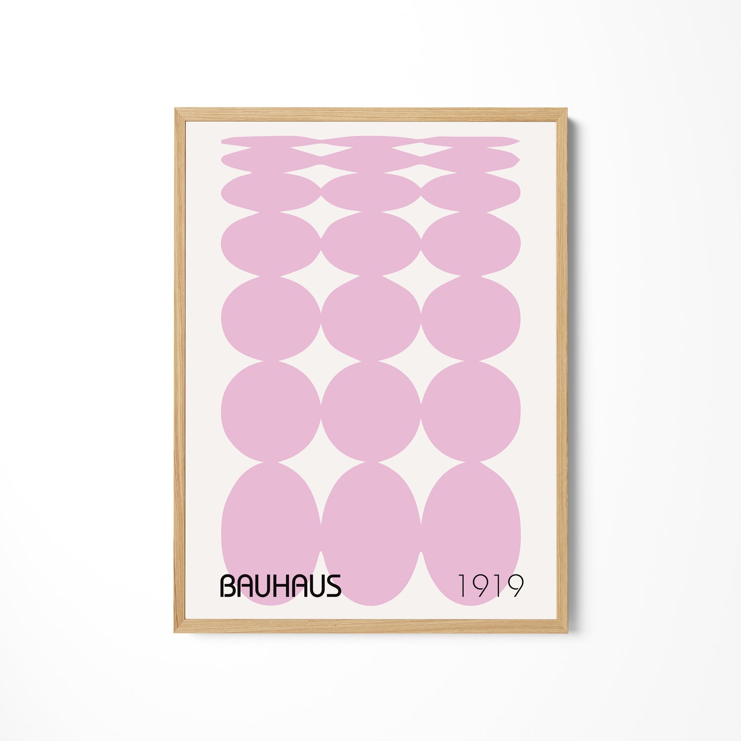 a pink poster hanging on a wall