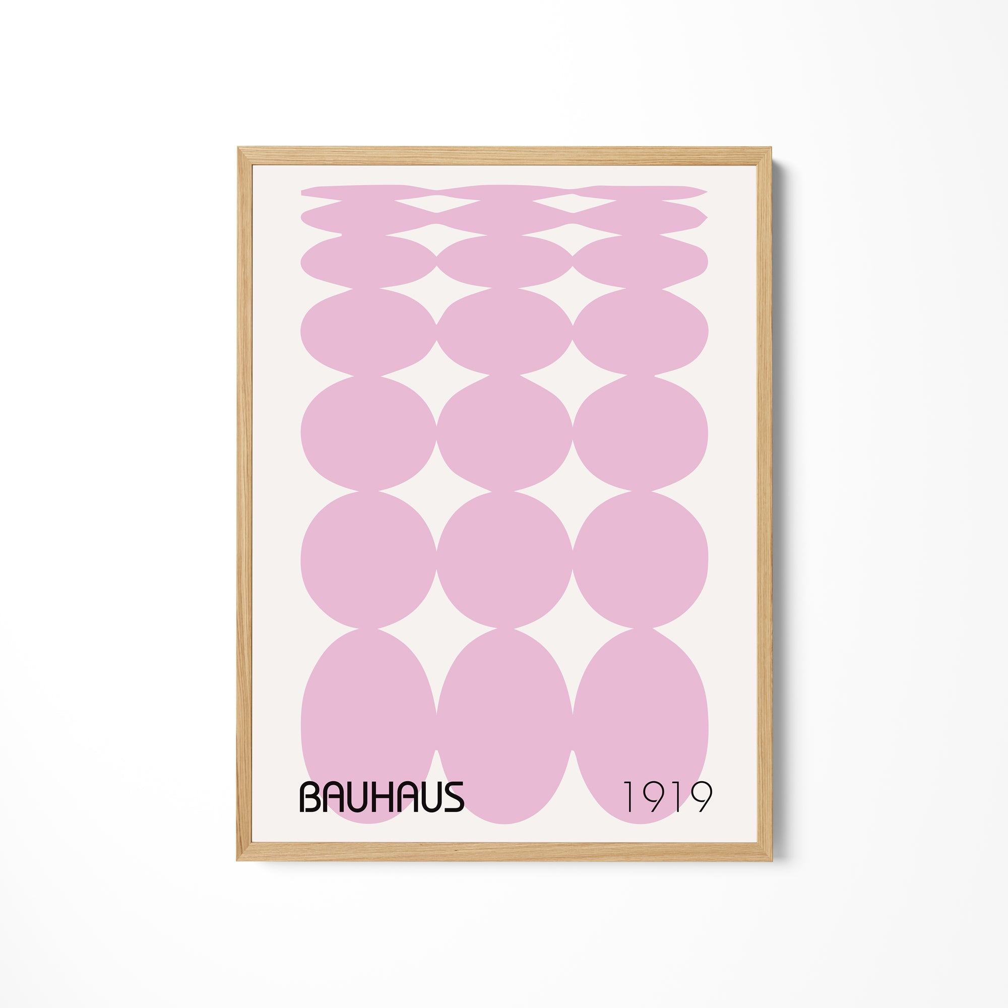 a pink poster hanging on a wall