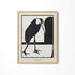 a black and white picture of a bird on a wall
