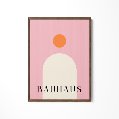 a pink and orange poster hanging on a wall