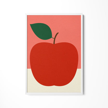a red apple with a green leaf on a pink background