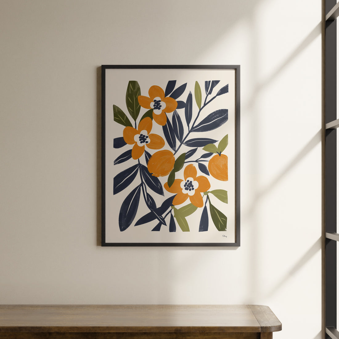 a painting hanging on a wall next to a wooden table