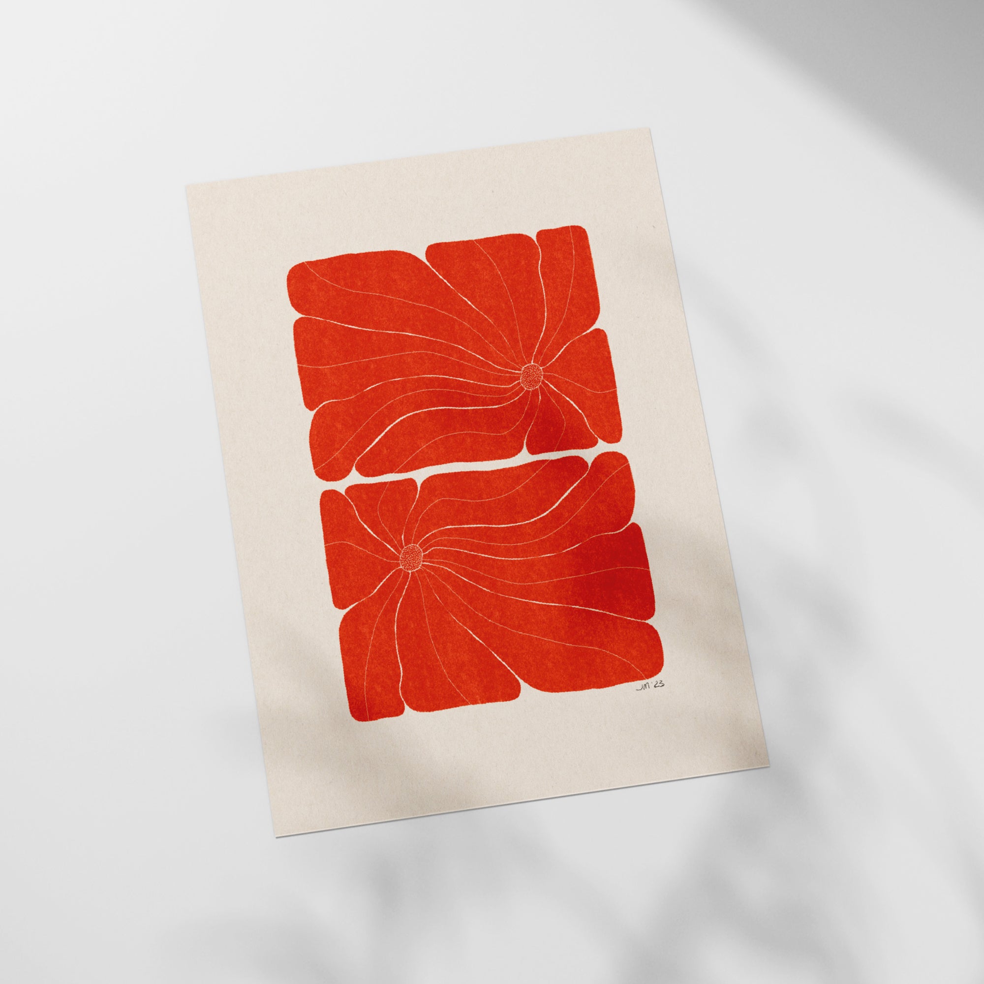 a piece of paper with a red flower on it