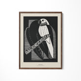 a black and white picture of a bird on a branch