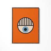 an orange square with a blue eye on it