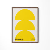 a yellow and white poster hanging on a wall