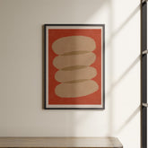 a picture hanging on a wall above a shelf