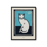 a white cat sitting on top of a blue background