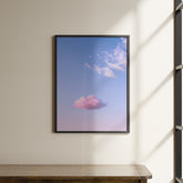 a picture of a pink cloud hanging on a wall