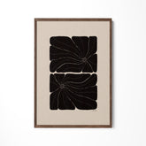 a black and white painting hanging on a wall
