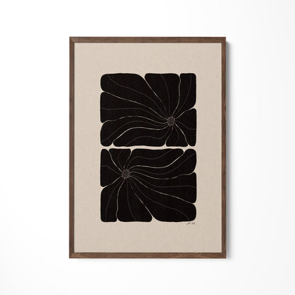 a black and white painting hanging on a wall