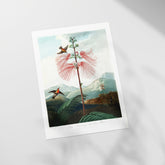 a picture of a bird flying over a flower