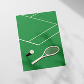 a tennis racket and ball on a green tennis court