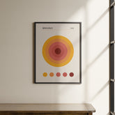 a picture hanging on a wall above a wooden table