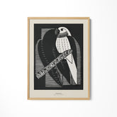 a black and white picture of a bird on a branch