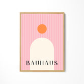 a pink poster with the word bauhaus on it