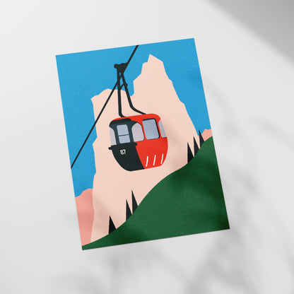 a picture of a red cable car on a mountain