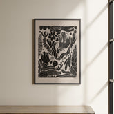 a picture hanging on a wall above a shelf