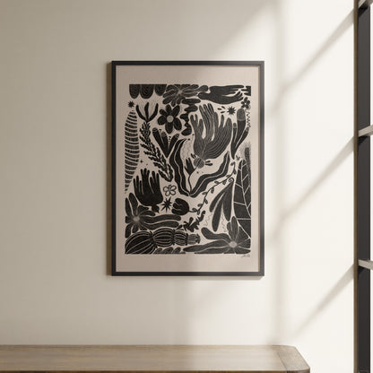 a picture hanging on a wall above a shelf