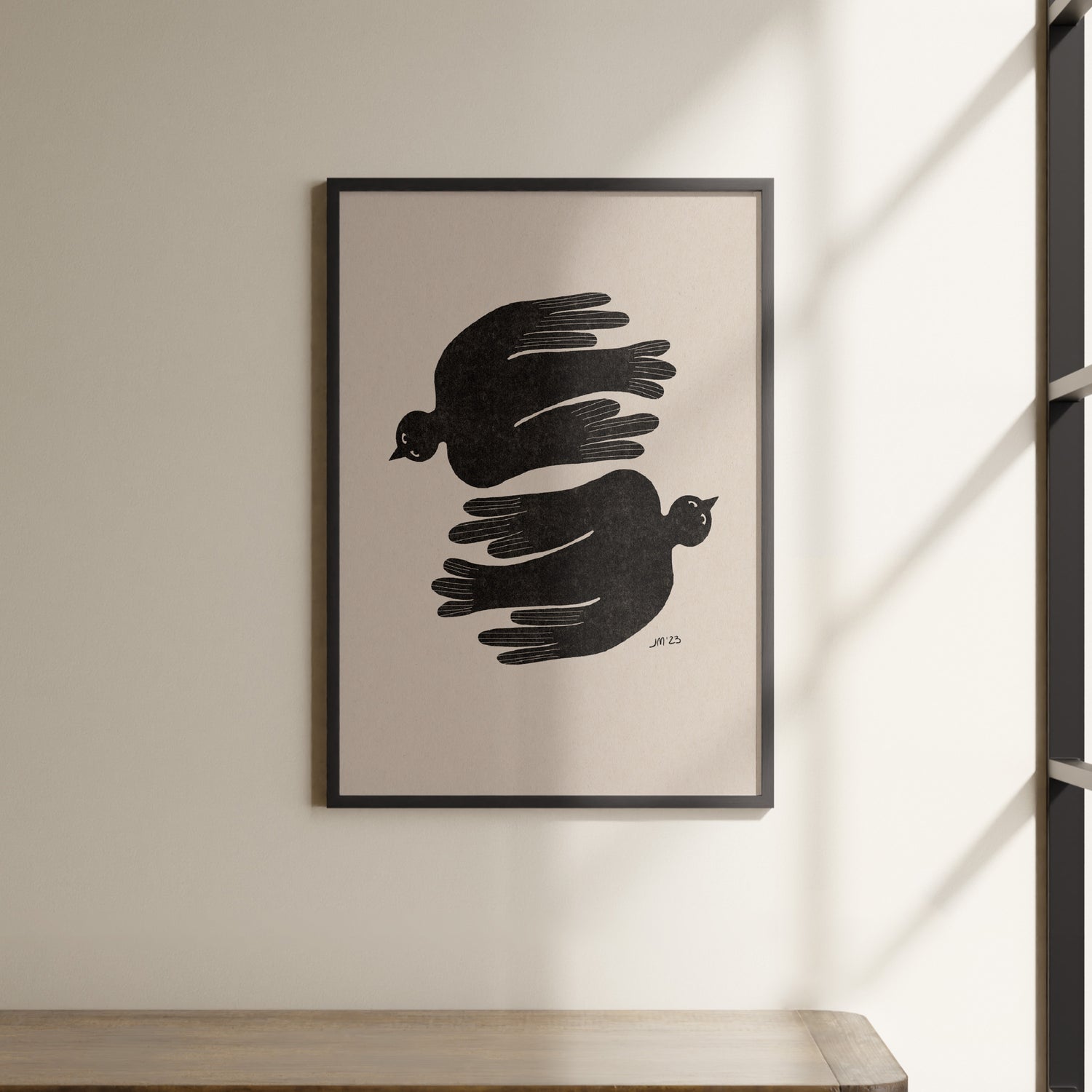 a black and white picture hanging on a wall