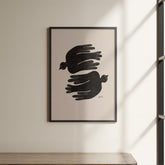 a black and white picture hanging on a wall